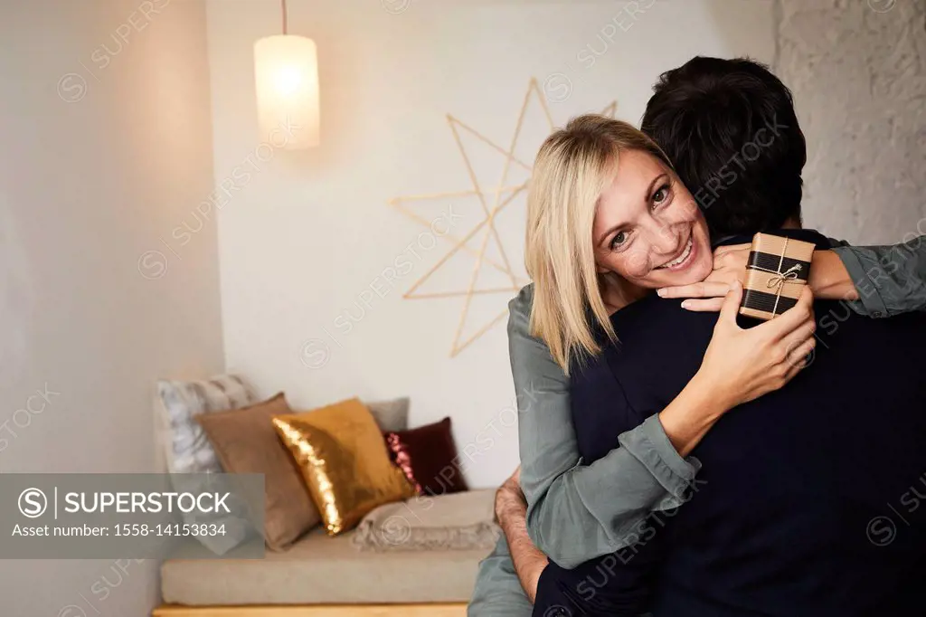 Young couple in love at home, half portrait