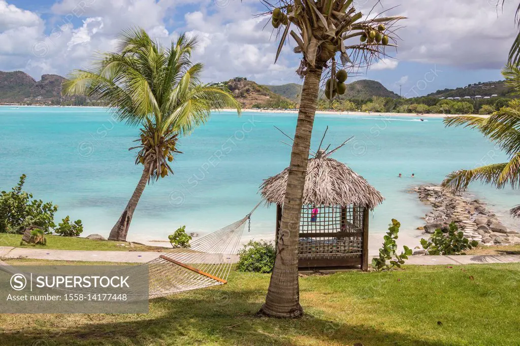 Hammock and palm trees surrounded by the Caribbean Sea Ffryes Beach Sheer Rocks Antigua and Barbuda Leeward Island West Indies