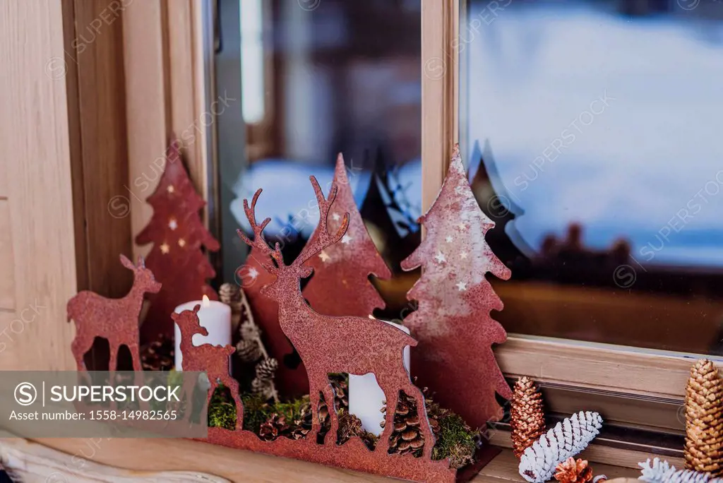 Windowsill, decoration, candlesticks and cones,