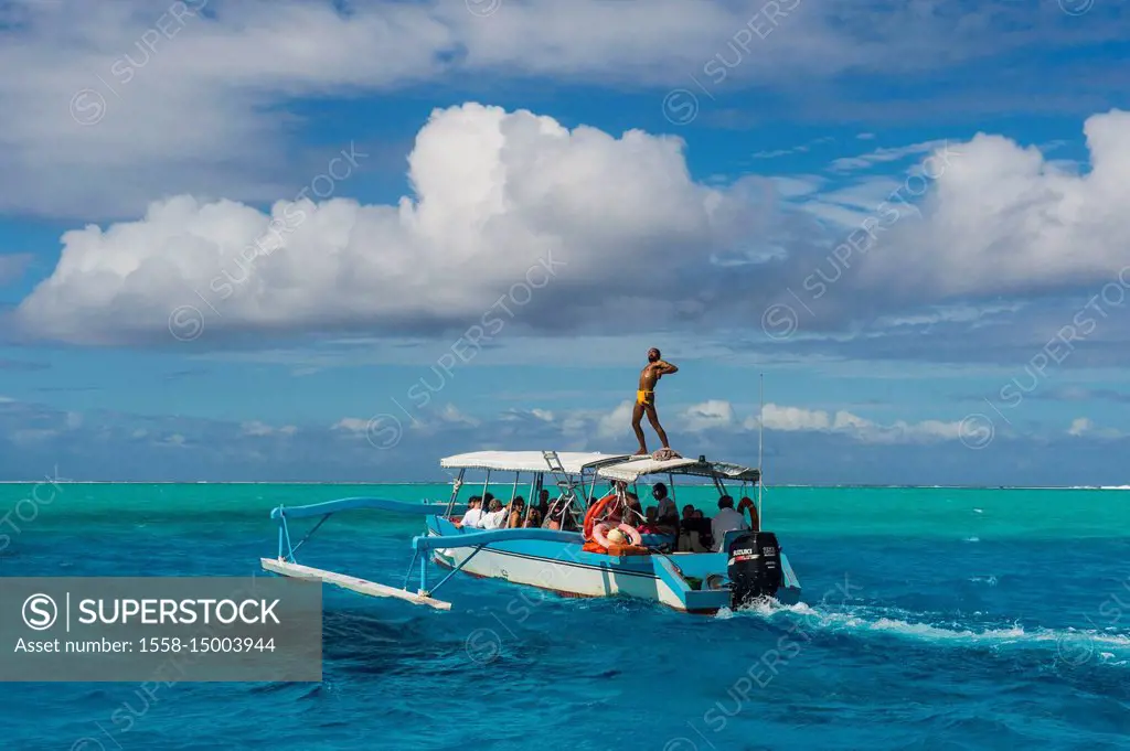 Little tourist boat in the turquoise lagoon of Bora Bora, French Polynesia