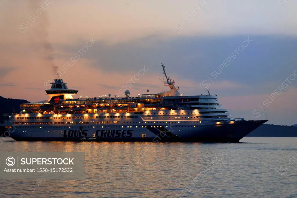 Cruise ship Louis Cruises departing in front of Fira, island Santorin, the Aegean Sea, the Cyclades, Aegean islands, Greece