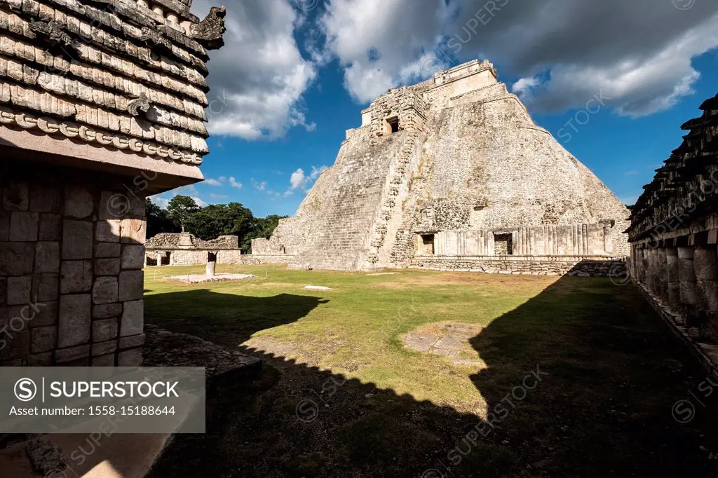 Uxmal, Yucatan, Mexico - October 13, 2017: The Pyramid of the Magician (Pirámide del Mago) towering in the Maya City of Uxmal, Mexico