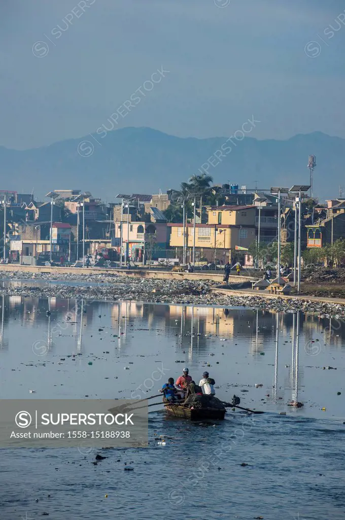 Totally polluted river Mapou flowing through Cap Haitien, Haiti, Caribbean