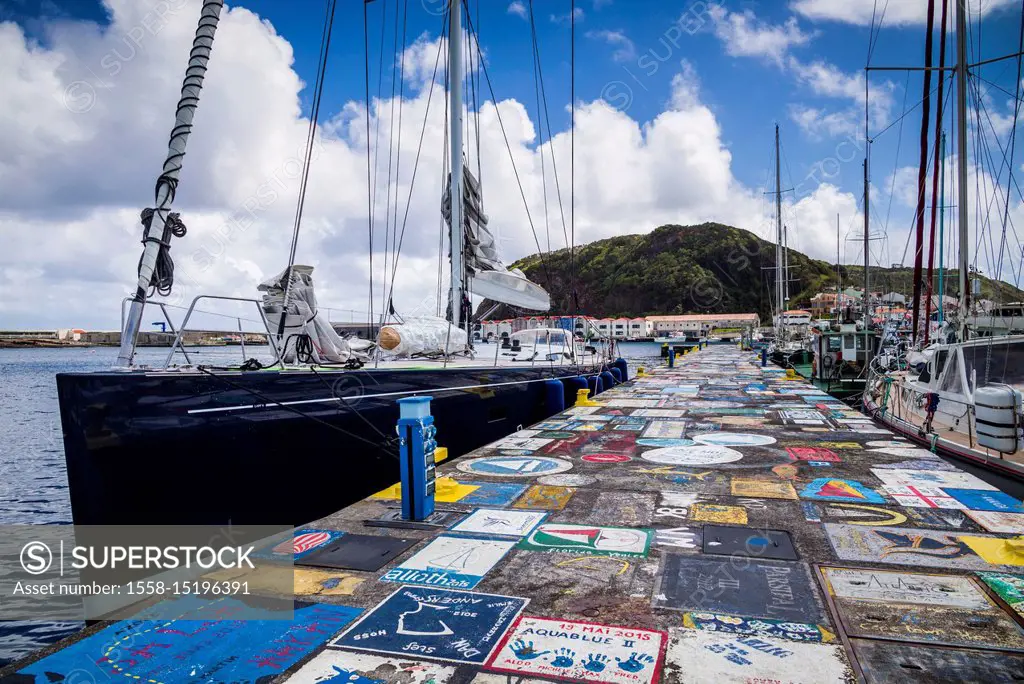 Portugal, Azores, Faial Island, Horta, Horta Marina with paintings by yacht crews on its piers