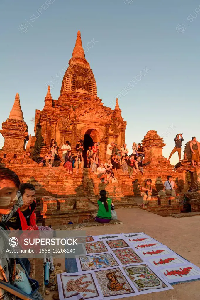 Bagan, temple Taung Guni Paya, tourists watch sunrise, souvenir hawker, Mandalay Region, Myanmar (Burma)