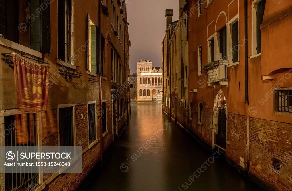 Old row of houses at canal at night, Venice, Veneto, Italy