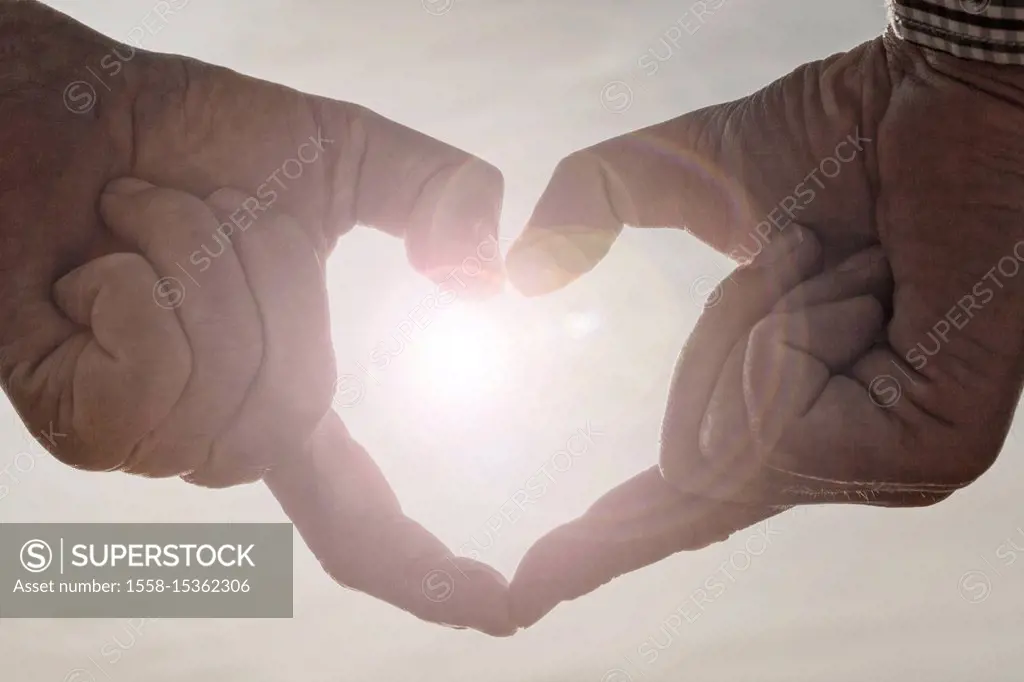 Men's hand forms heart