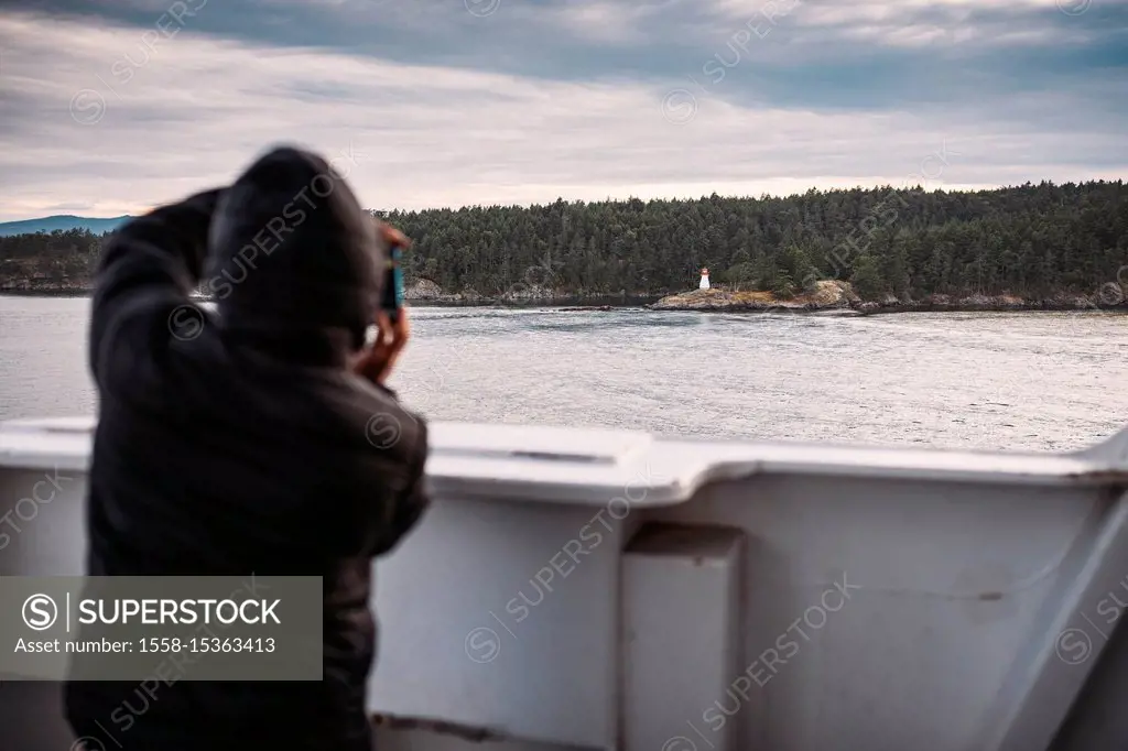 Ferry trip to Vancouver Island, man photographing, British Columbia, Canada