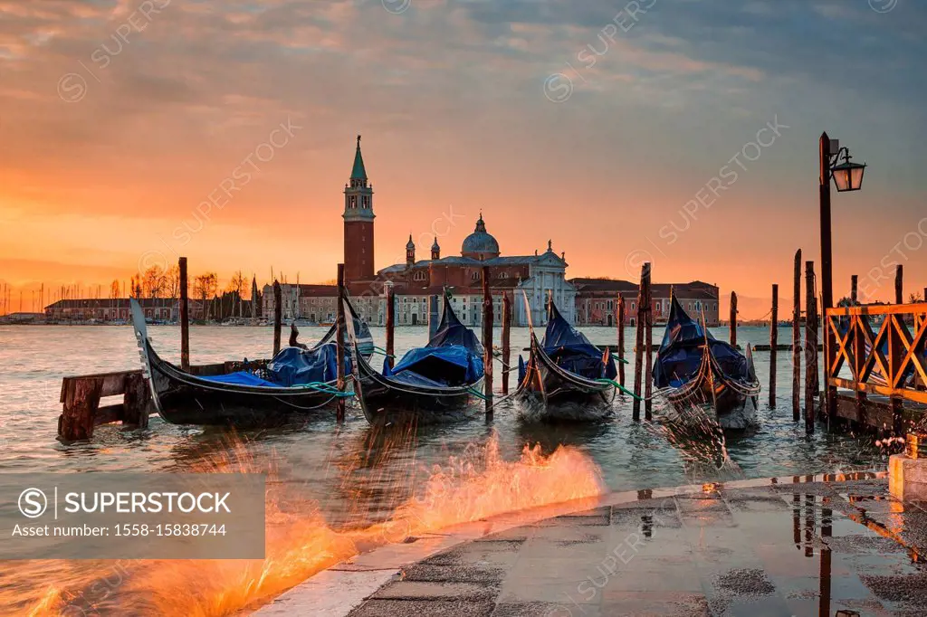 Gondolas on the Grand Canal at sunrise in Venice, Italy