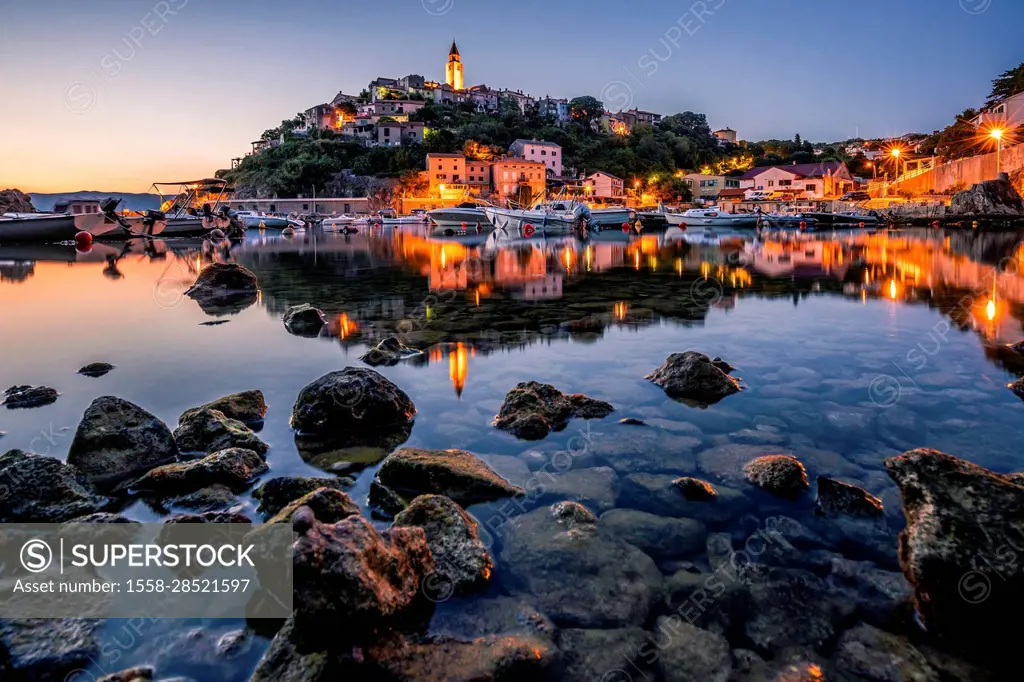 Morning view of a Mediterranean place by the sea, beautiful illuminated skyline of the town of Vrbnik and its bay. Island krk, Croatia