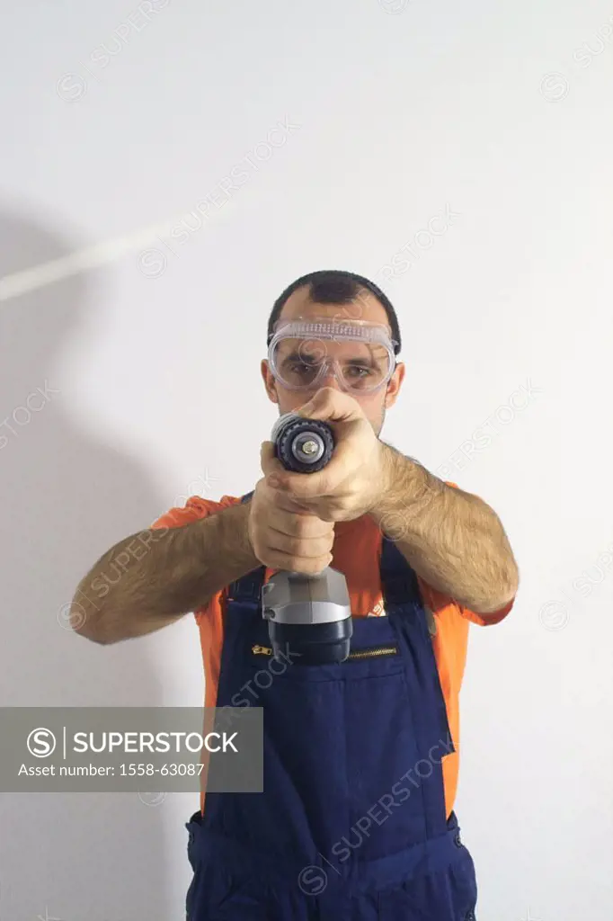 Do-it-yourself, man, goggles,  Drill, fuzziness,  Do-it-yourselfers, 20-30 years, working clothes, protection, glasses, overalls, home works, renovati...