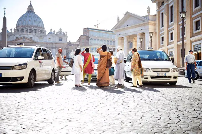 Indian tourists in front of St. Peter's Basilica, Vatican, Italy