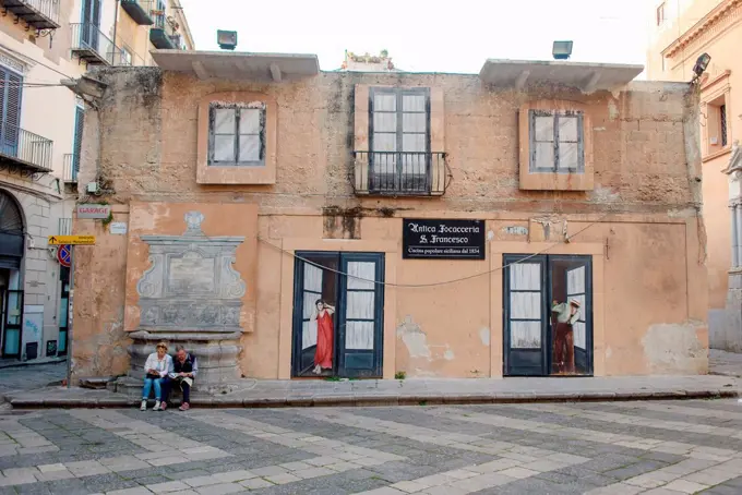 Two tourists in the Old Town of Palermo, Sicily