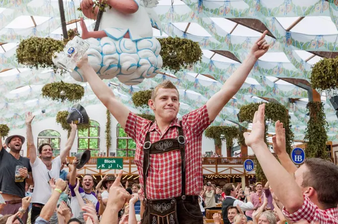 Germany, Bavaria, Munich, Oktoberfest, Man Drinking Beer