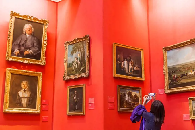 England, Cambridgeshire, Cambridge, Fitzwilliam Museum, Tourist Taking Photo of Artwork