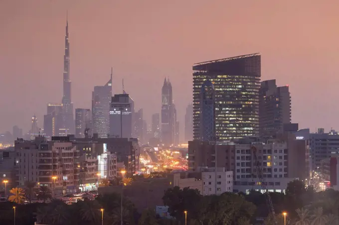 UAE, Dubai, Deira, view of Downtown Dubai Skyscrapers from Dubai Creek, dusk