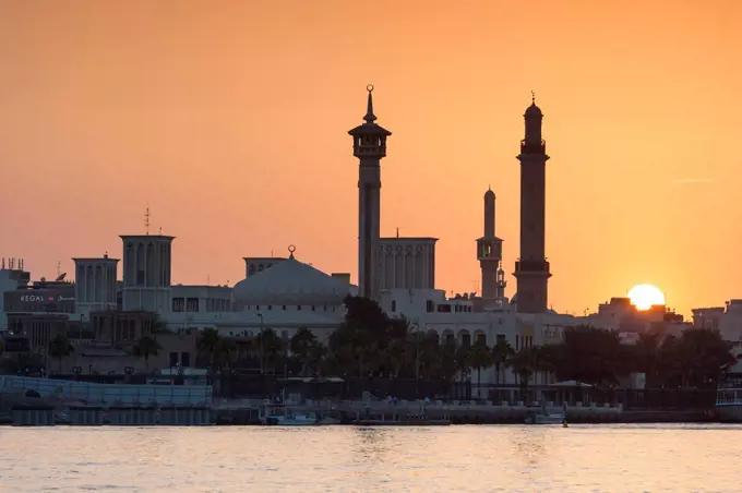 UAE, Dubai, Bur Dubai, sunset over The Rulers Court from Dubai Creek