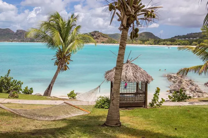 Hammock and palm trees surrounded by the Caribbean Sea Ffryes Beach Sheer Rocks Antigua and Barbuda Leeward Island West Indies