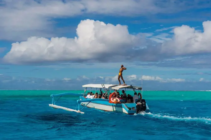 Little tourist boat in the turquoise lagoon of Bora Bora, French Polynesia