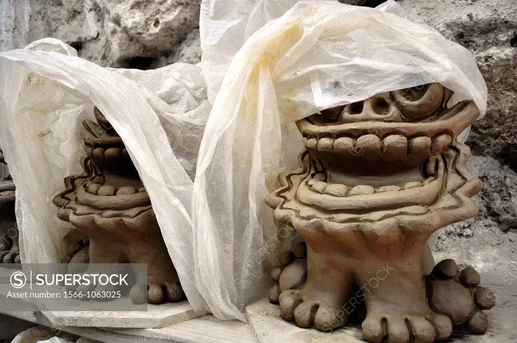 Ishigaki Island Okinawa, Japan: Shisa statuettes, made at Yoneko-yaki Pottery handicraft studio  Shisa is a traditional Ryukyuan decoration, often in ...