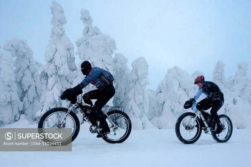 bikers in winter, Orlicke Mountains, Czech Republic.