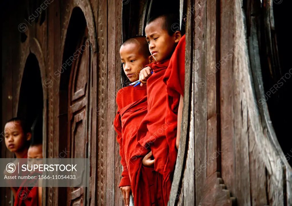 These novices are standing in the famous old teak wood Shwe Yan Pyay Monastery, near Inle Lake in Myanmar´s Shan State, during Thingyan, the Burmese N...