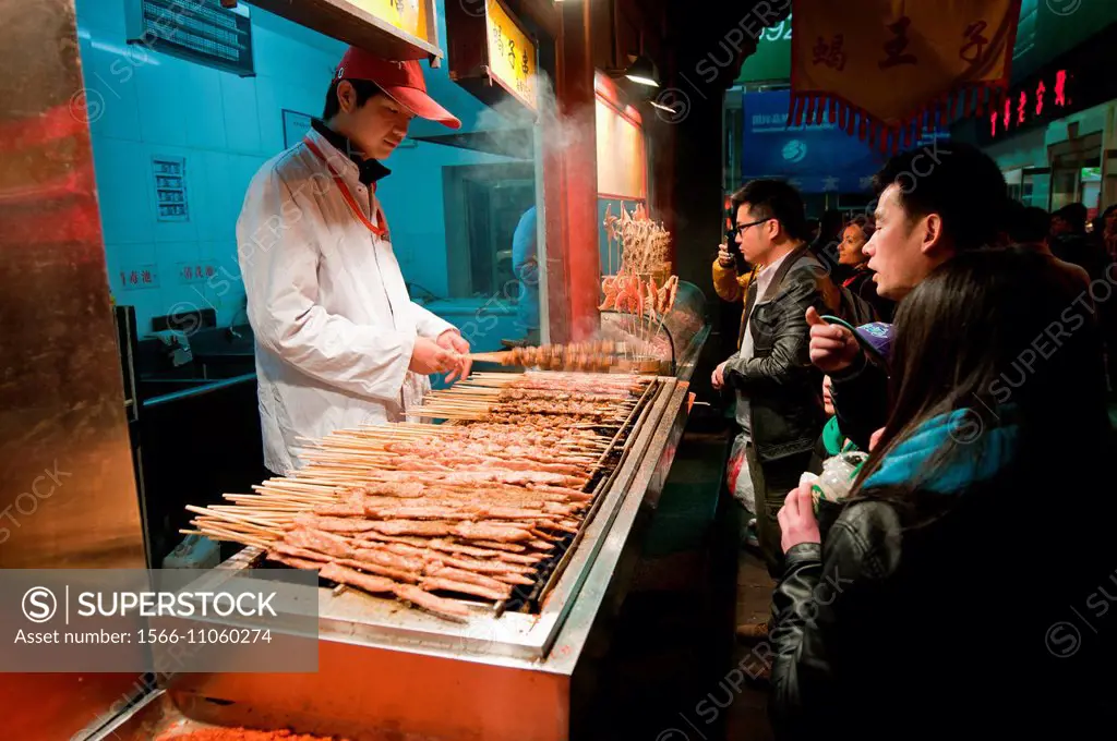 Chuanr - small pieces of roasted meat on food stall at Wangfujing Snack Street in Dongcheng District, Beijing, China.