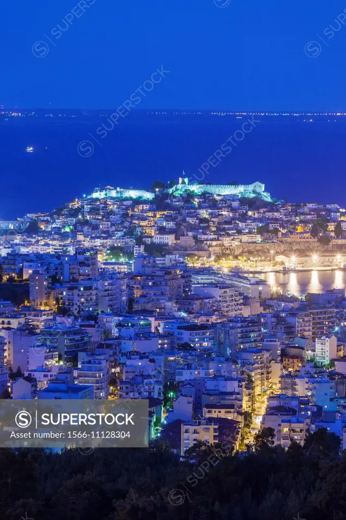 Greece, East Macedonia and Thrace Region, Kavala, elevated city view with Kastro fortress, evening.