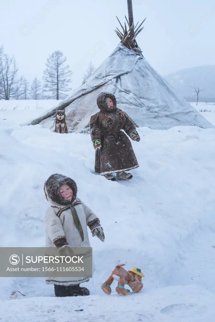 Two small nenets boys at the nomadic reindeer herders camp. Polar Urals, Yamalo-Nenets autonomous okrug, Siberia, Russia.