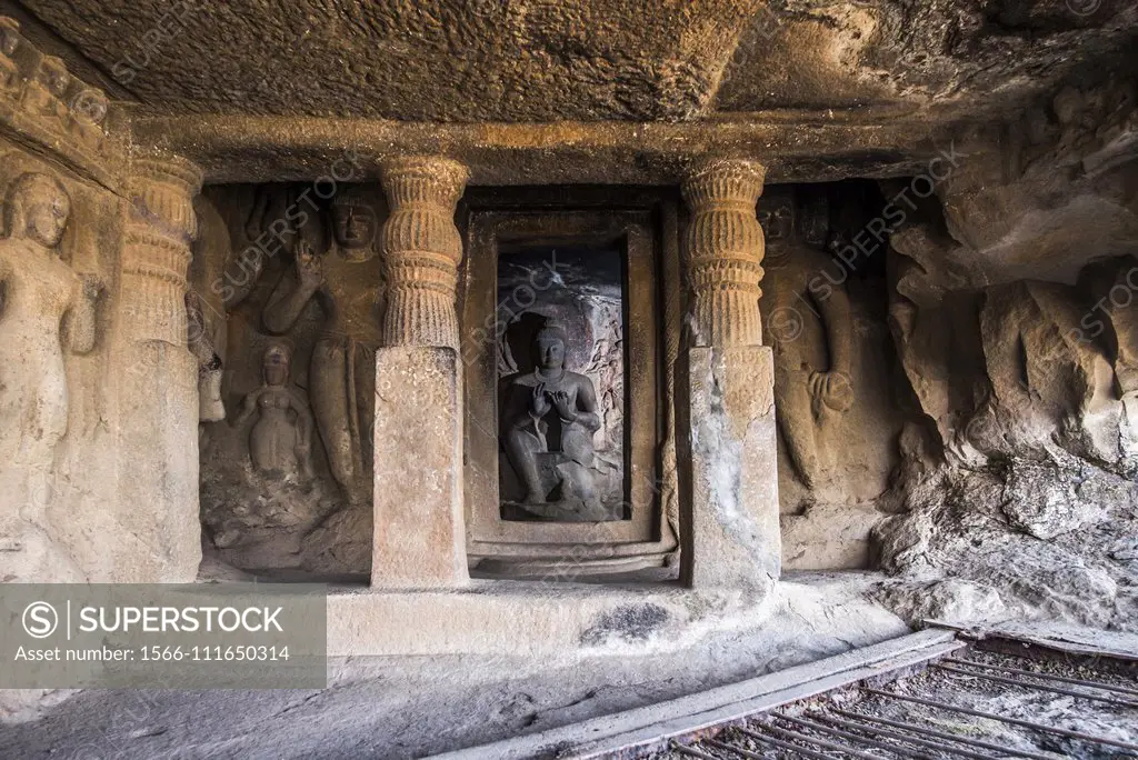 Cave 23, Buddha in shrine seated in pralambapadasa with dharmachakra pravartana mudra or teaching attitude, Nasik, Maharashtra.