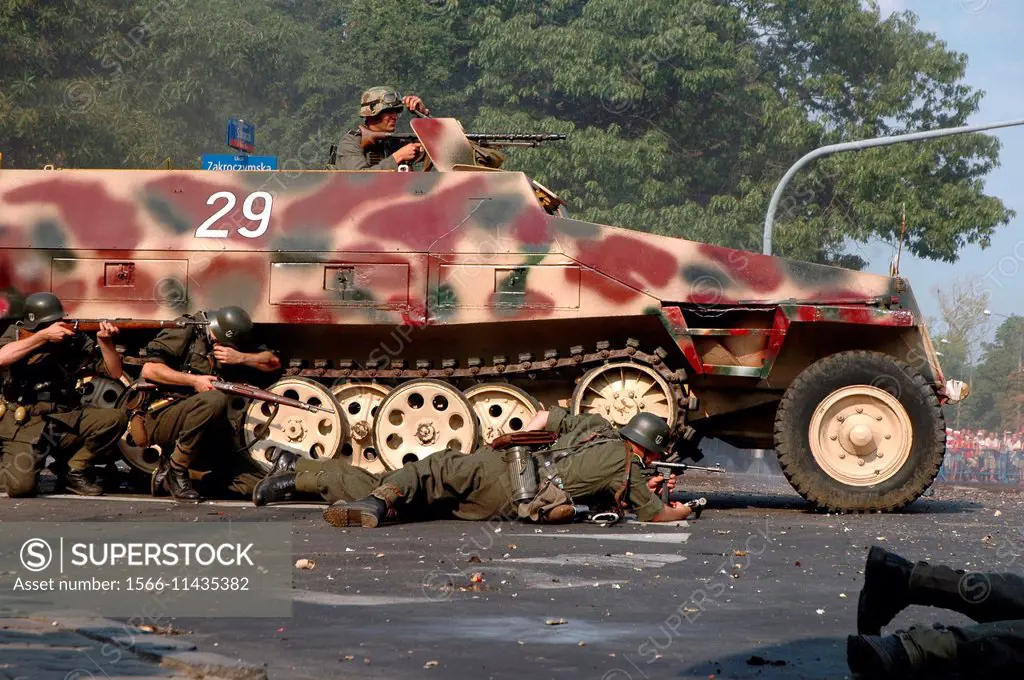 Historical reenactment of Warsaw Uprising in 1944 during II World War. Man in nazi soldier uniform in SDKFz 251 ""Rosie"" vehicle.