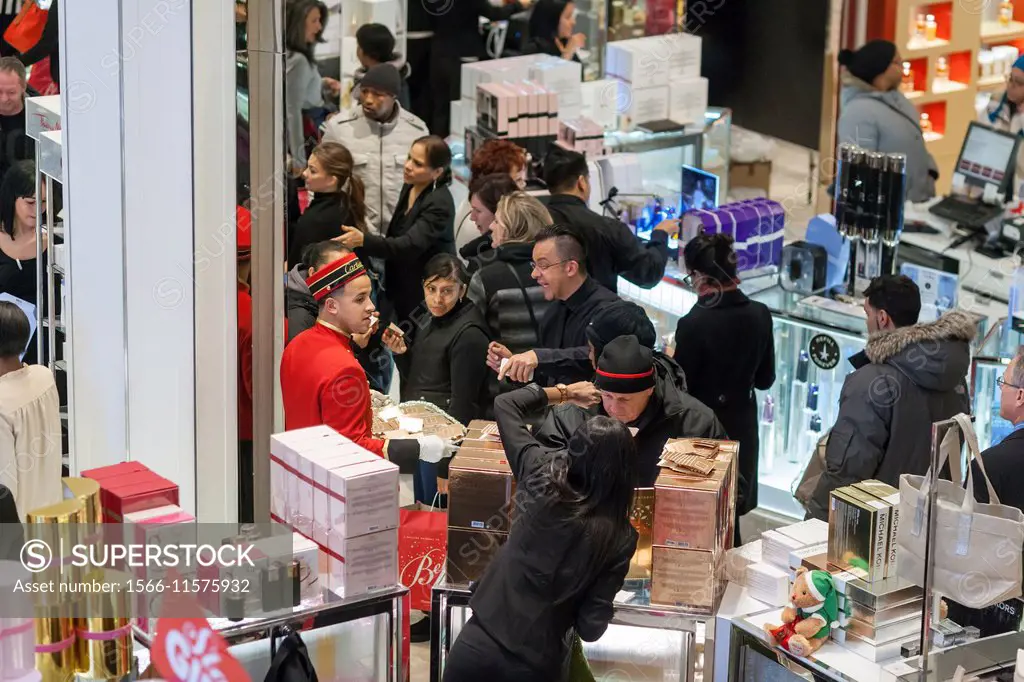 Shoppers at the Cartier perfume counter in the Macy s Herald