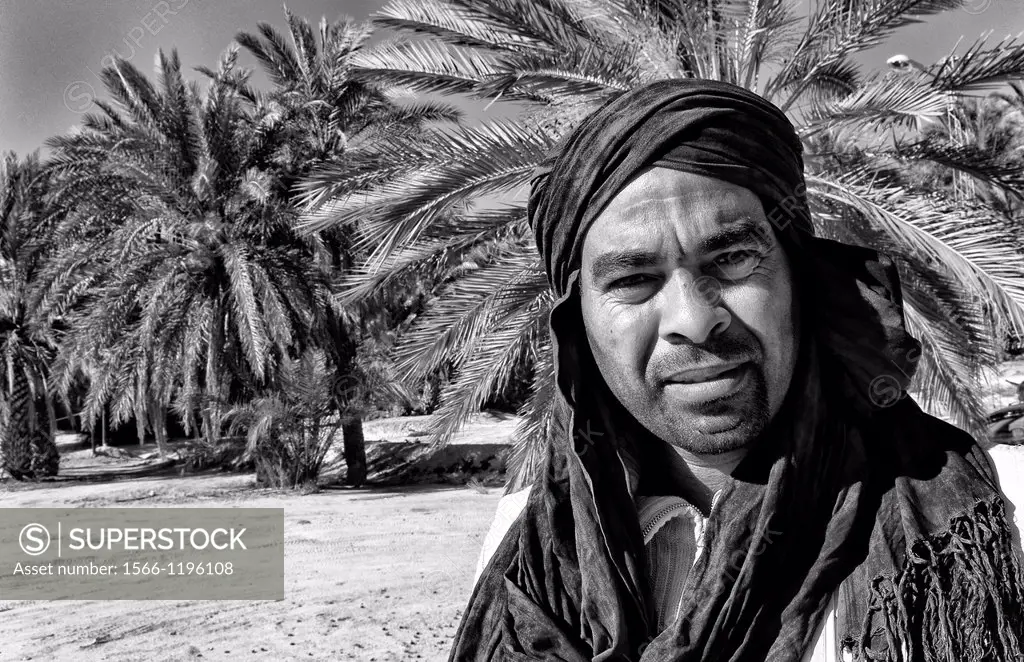 Arab man with turban in oasis Town with plam trees of Chebika near Mides and Tamerza Tunisia in Africa