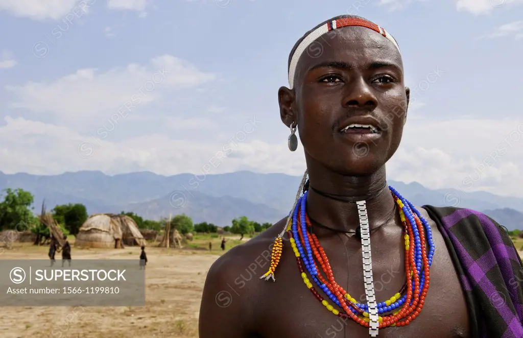 Arbore Tribe Ethiopia Africa Erbore tribal village Lower Omo Valley young boy in dress and jewelry 27