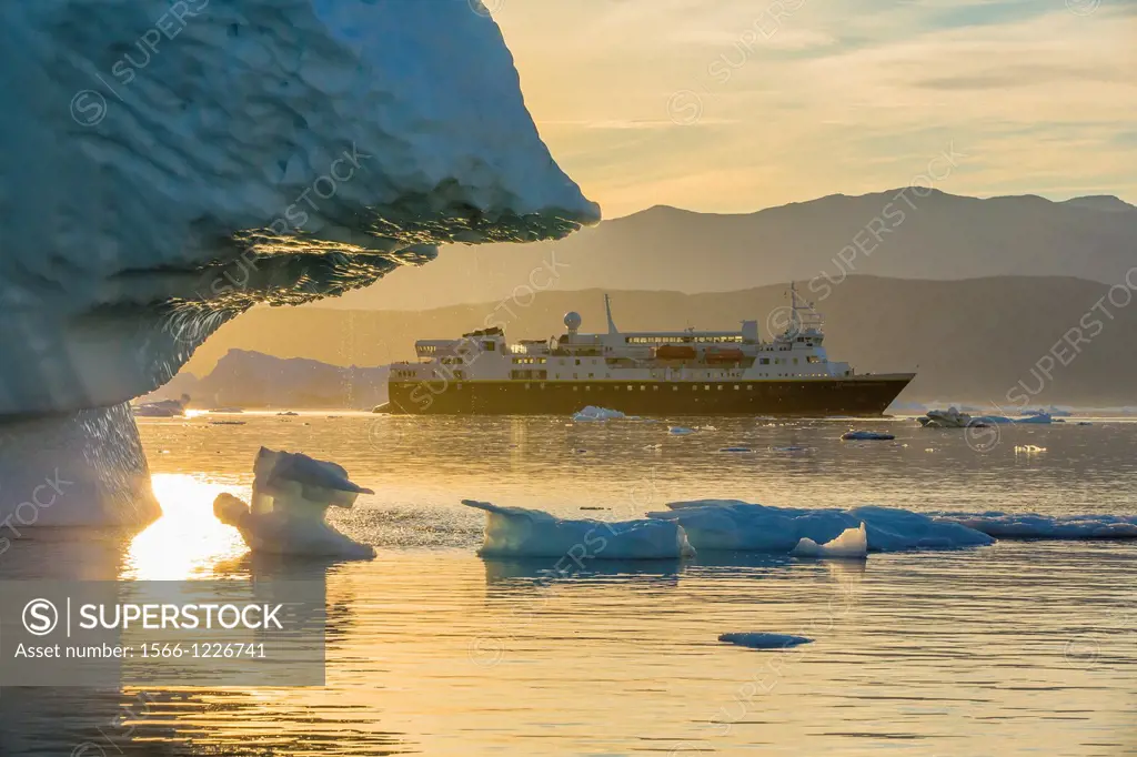 The Lindblad Expeditions ship National Geographic Explorer amongst grounded  icebergs near Rode O Red Island, Scoresbysund, Northeast Greenland -  SuperStock