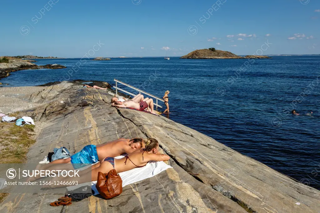 People sunbathing at Koster Islands, Vastra Gotaland region, Sweden.