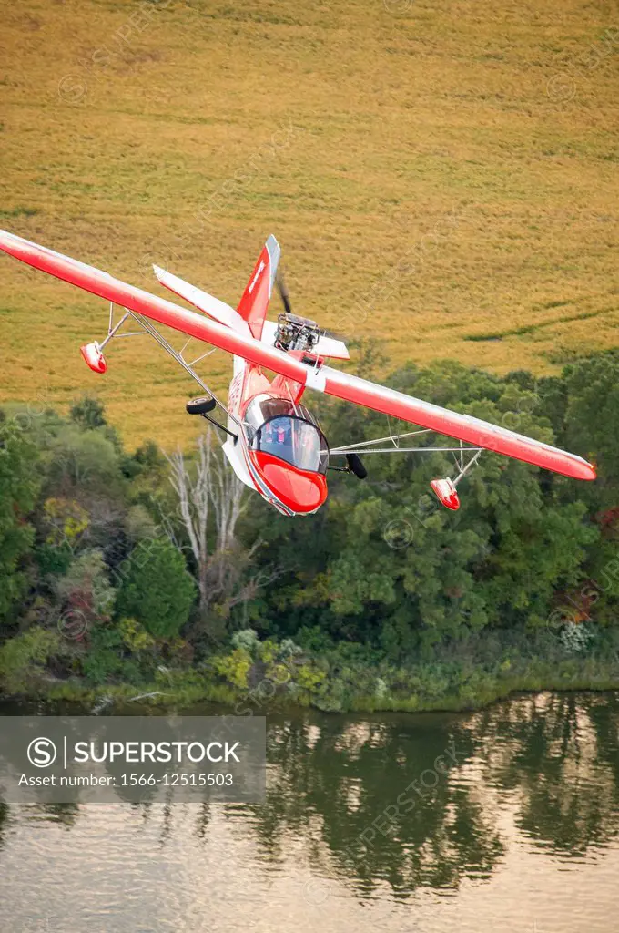 Searey, a small seaplane flying over a field in Maryland, USA.