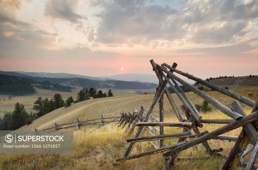 Classic log fence in ranch lands of Granite County Montana at sunset