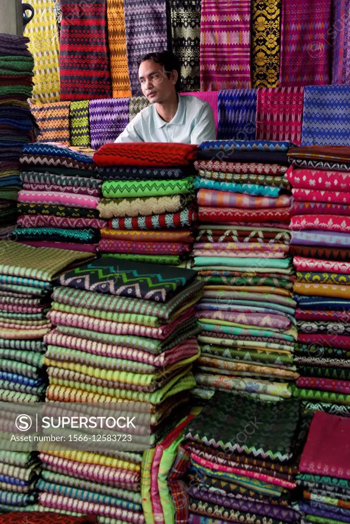 Myanmar, Rakhine State, Sittwe (Akyab), Longyi vendor.