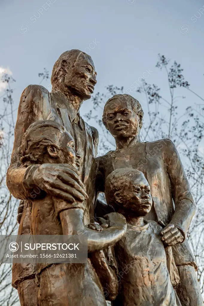 Bronze statue of an African Amerian Family on River Street, placed along River Street in Savannah, Georgia in 2006, represents a modern black family t...