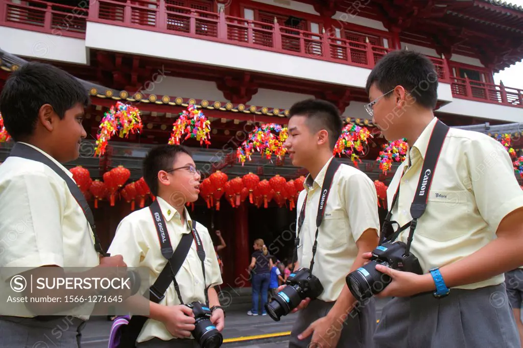 Singapore, Chinatown, Asian, teen, boy, student, camera, school uniform, class trip, outside, Buddha Tooth Relic Temple and & Museum,