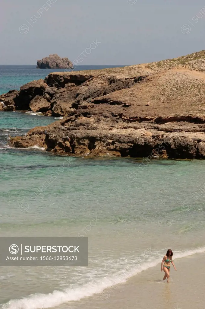 Tourist in the beach at the end of Torrent des Porrassar, Artà, Mallorca, Spain, Europe.