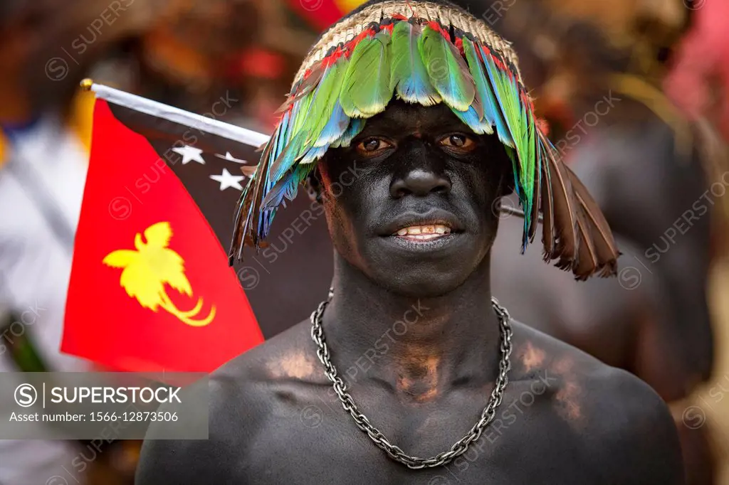 PNG flag, Goroka festival, 140 ethnic tribes come together for three day Sing sing, Goroka, Eastern Highlands, Papua New Guinea.