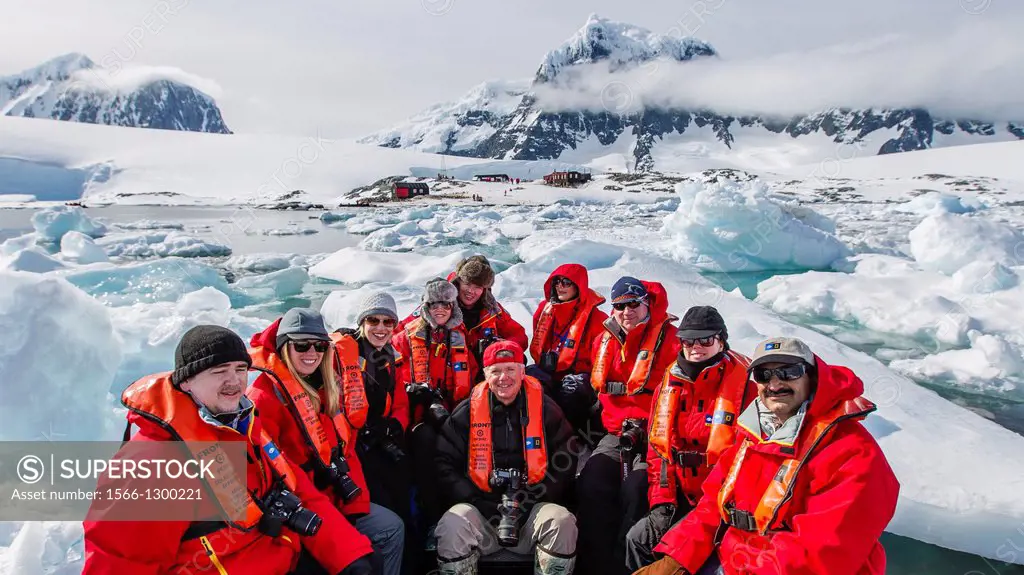 Guests from the Lindblad Expedition ship National Geographic Explorer enjoy Port Lockroy, Antarctica by Zodiac.