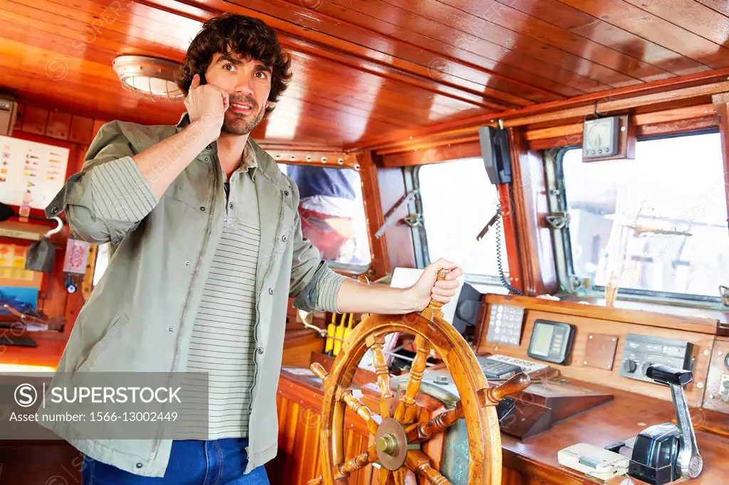 Sailor at the helm of a sailboat, galleon. Basque Country. Spain