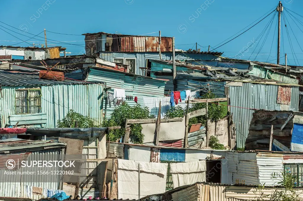 Shantytown made of wood and corrugated iron shacks with electricity supplied . . . Khayalitsha, Cape Town, South Africa.