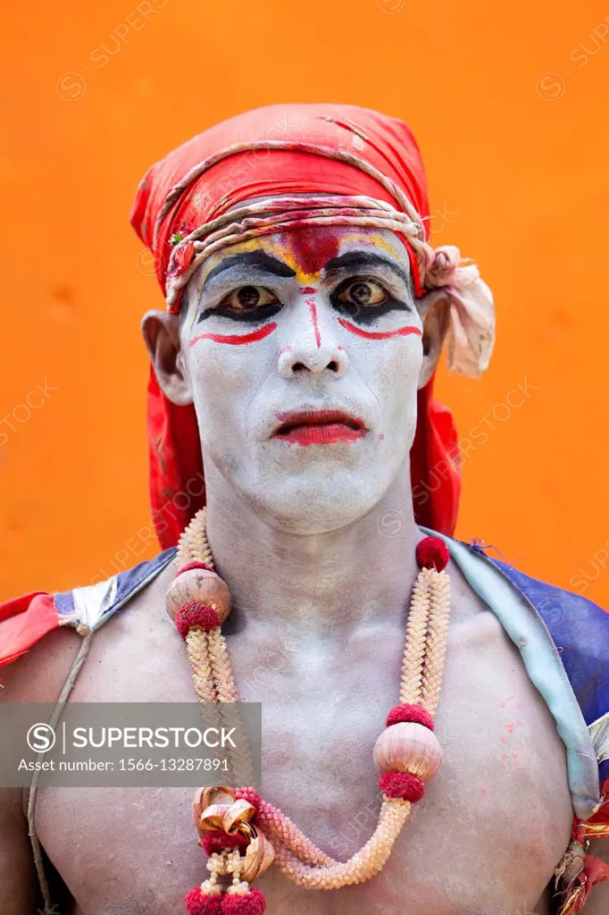 Portrait of a Hindu community devotee prepare as he takes part in a festival called Lal Kach (Red Glass) during the last day of the Bangla month in Mu...