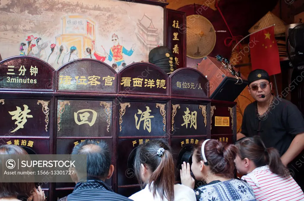 Shanghai Puppet Show in the ancient town, Shanhai. The Chinese love their children, and are restricted, if city dwellers, to but one. The fine for bre...