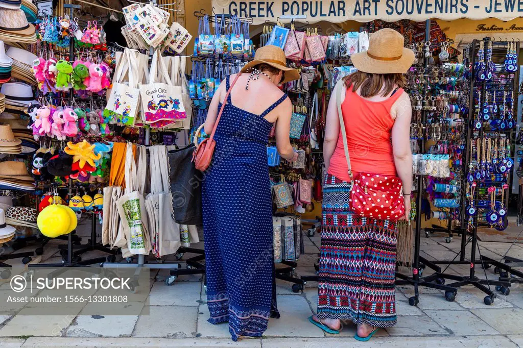 Two Young Women Shopping For Souvenirs, Corfu Old Town, Corfu, Greece.