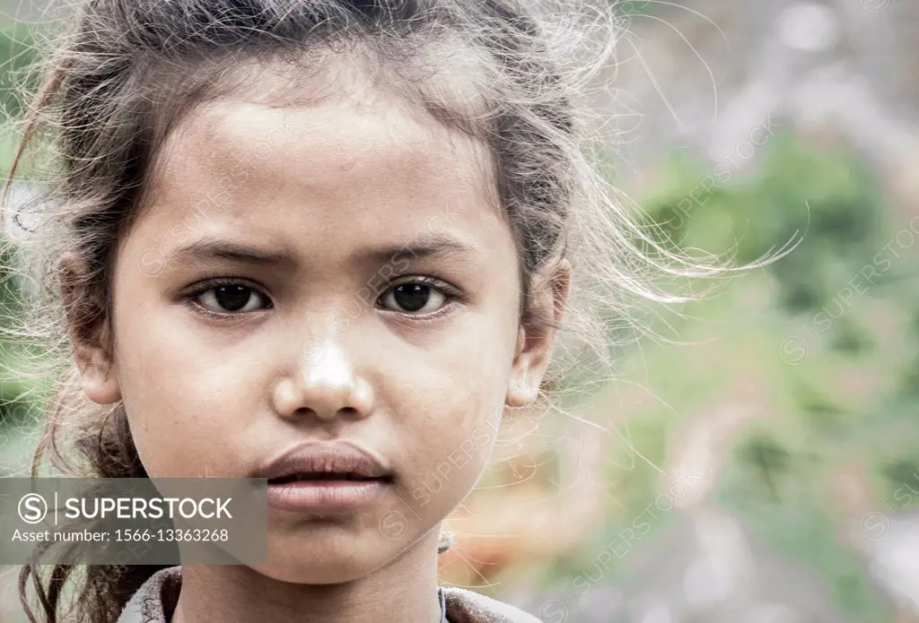 Cambodian girl staring at the camera. Battambang, Cambodia.